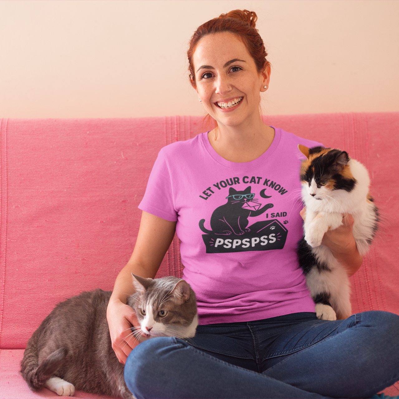 Woman sitting with cat wearing pspspss cat lover t-shirt in Azalea pink