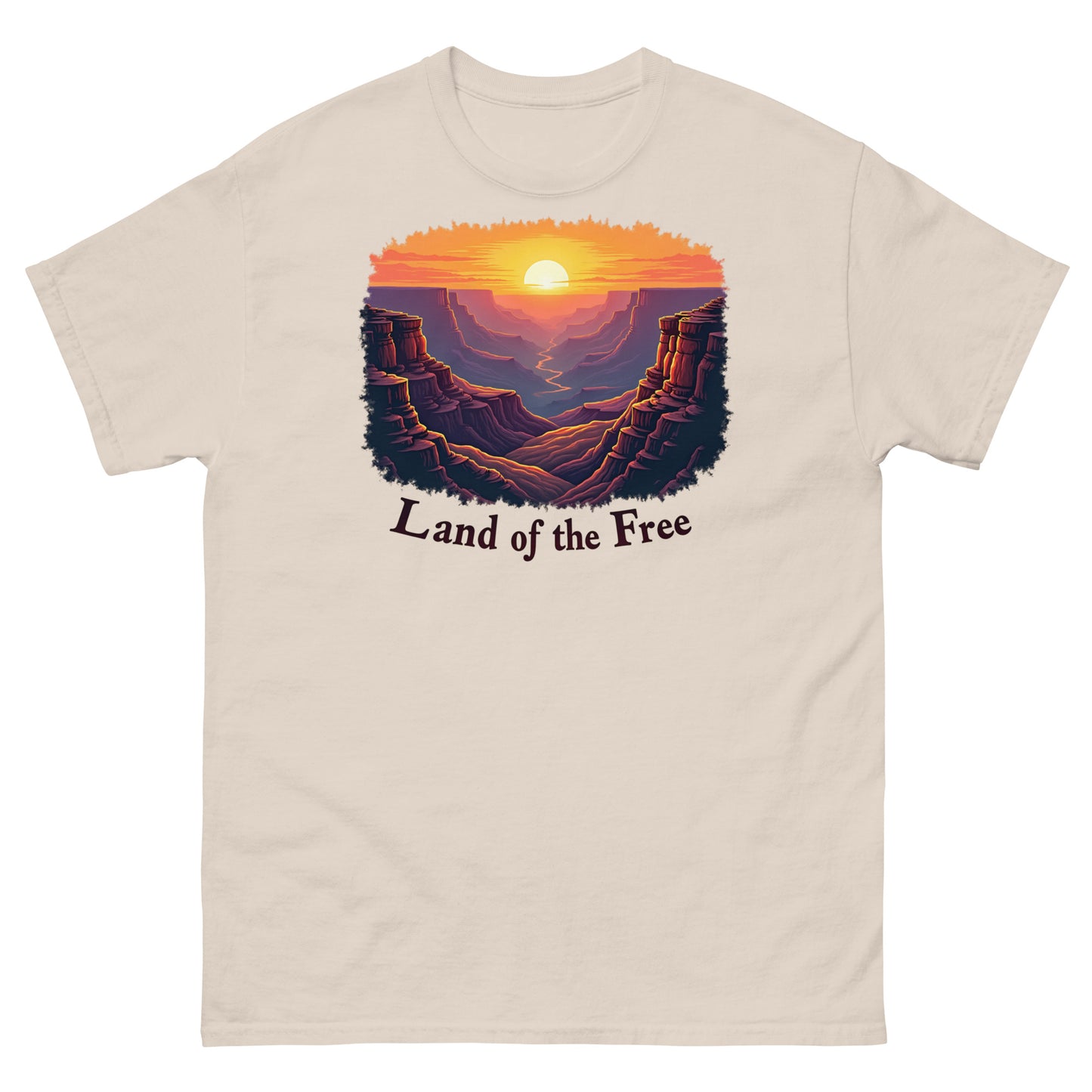 Natural t-shirt with a canyon sunrise graphic and “Land of the Free” slogan.