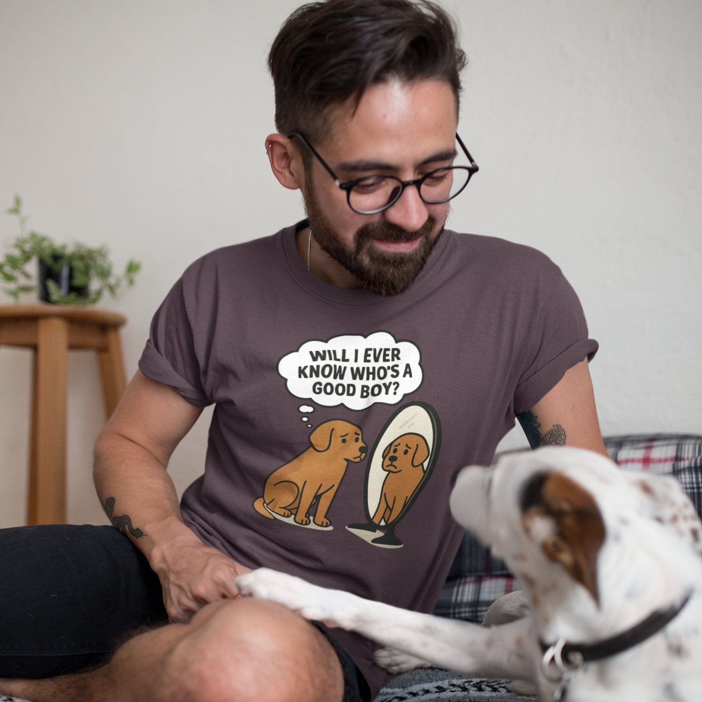 Man smiling with dog while wearing Who’s a Good Boy t-shirt with sad dog mirror graphic