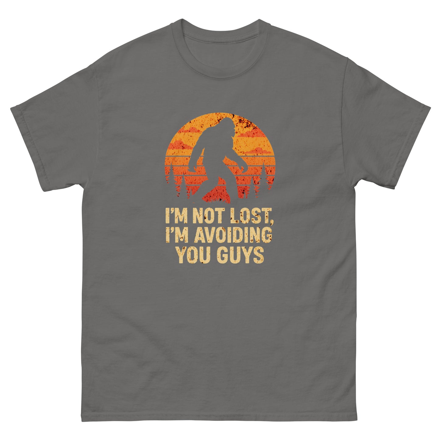 Charcoal-colored sarcastic introvert t-shirt featuring bigfoot and orange forest sunset
