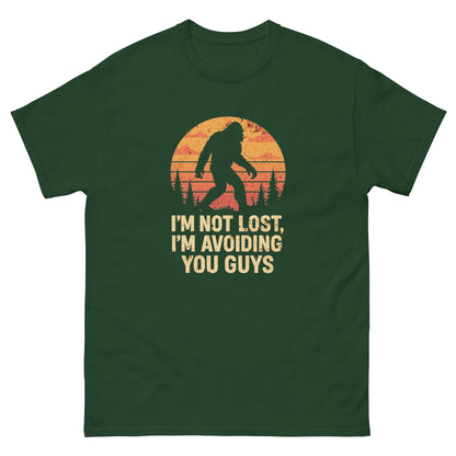 Forest green camping humor shirt with bigfoot design and funny avoidance quote