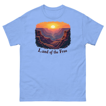 Carolina blue t-shirt featuring a scenic canyon sunrise design with “Land of the Free” text.