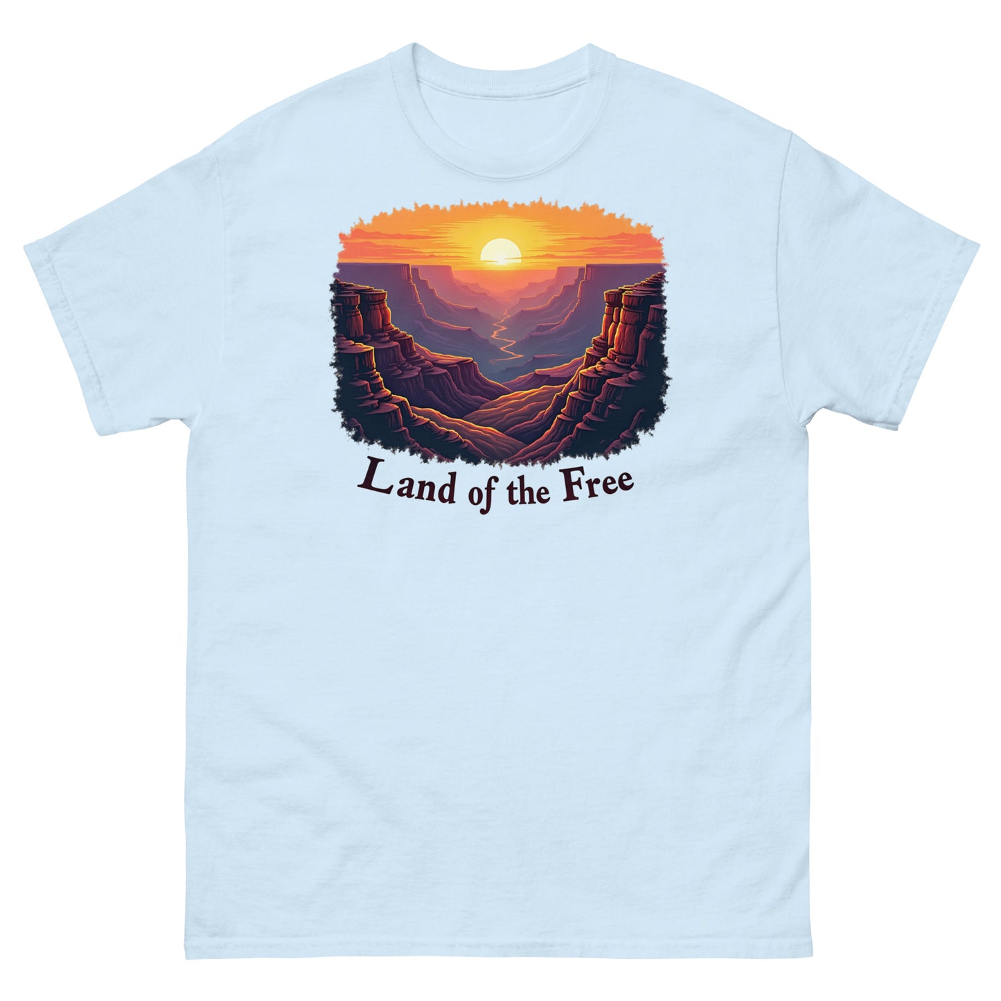Light blue t-shirt with a scenic canyon sunrise graphic and “Land of the Free” statement.