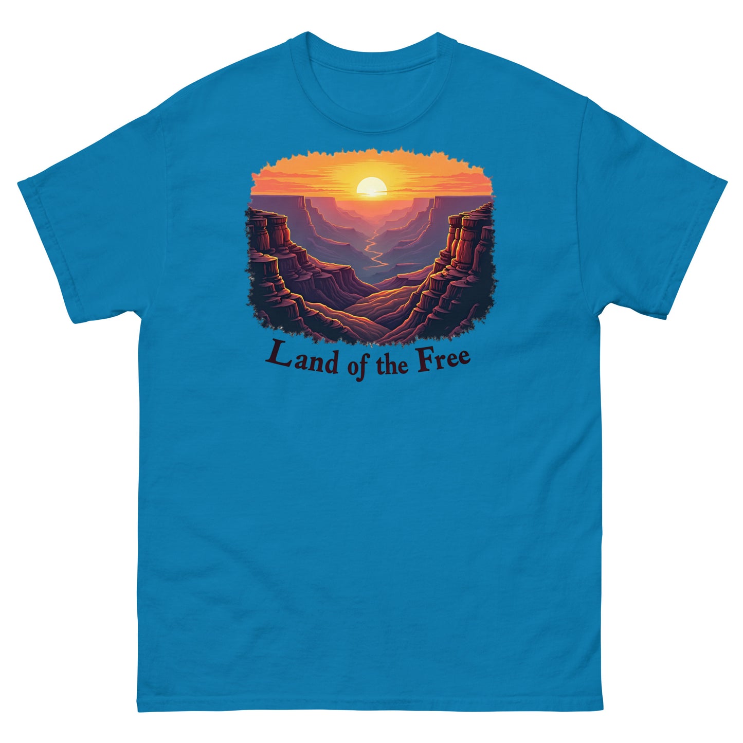 Sapphire t-shirt showcasing a vintage canyon sunrise graphic with “Land of the Free” text.