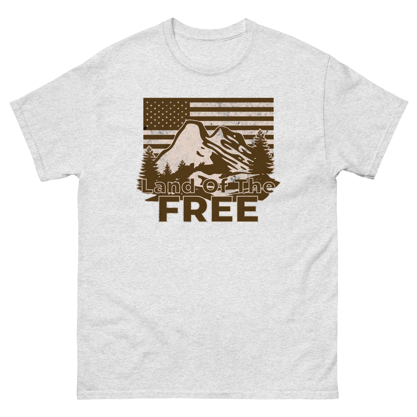 Ash t-shirt featuring detailed mountain and pine trees with American flag background and “Land of the Free” slogan.