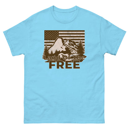 Sky blue t-shirt featuring a vintage “Land of the Free” design with mountain scene and American flag.