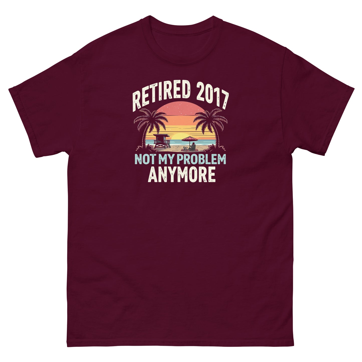 Maroon t-shirt featuring vintage sunset beach design and bold “Retired 2017 Not My Problem Anymore” slogan