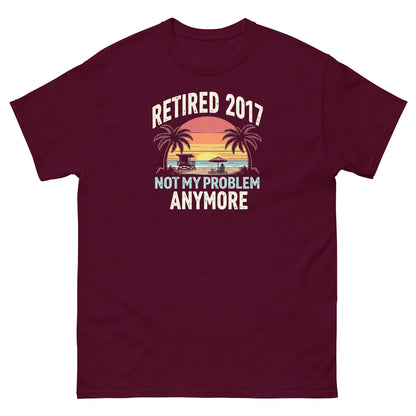 Maroon t-shirt featuring vintage sunset beach design and bold “Retired 2017 Not My Problem Anymore” slogan