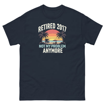 Navy blue t-shirt with vibrant beach sunset and “Retired 2017 Not My Problem Anymore” text