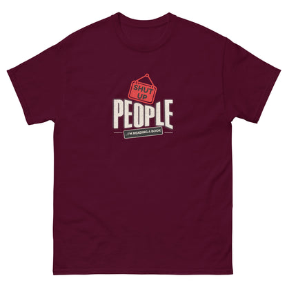 Maroon shirt featuring "Shut Up People, I'm Reading a Book" design